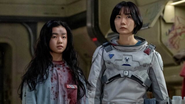 Bae Doona as Dr. Song Ji-an with Kim Si-a as Luna 073 in "The Silent Sea"